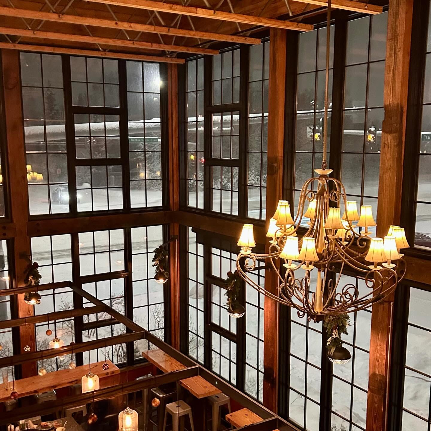 Chandelier over the dining room windows